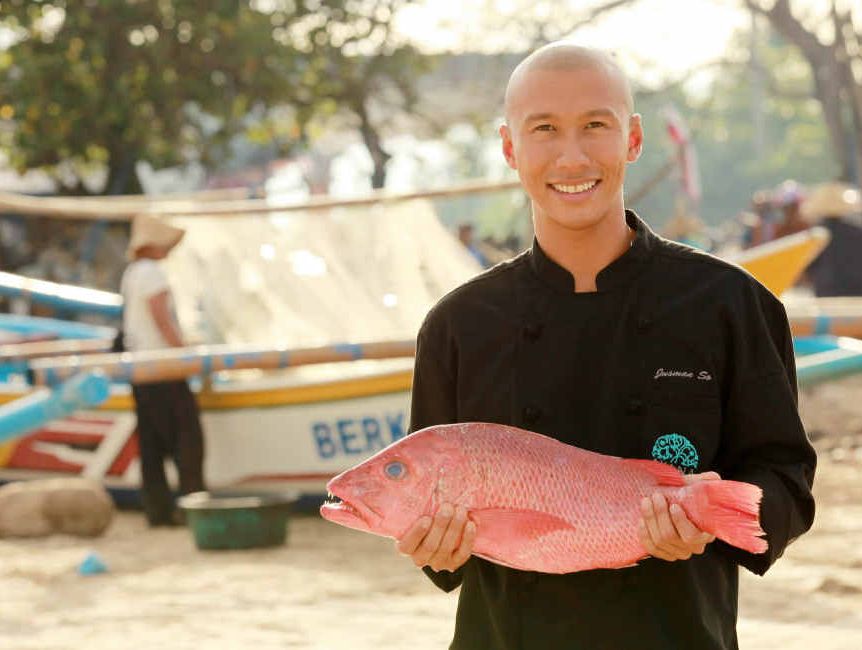 Dava head chef Jusman So selects a fish from the markets at Jimbaran Bay. Dava head chef Jusman So selects a fish from the markets at Jimbaran Bay.